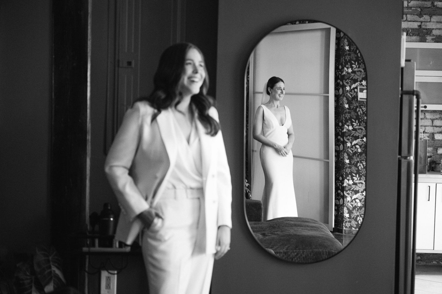 A black and white photographic series showing reflections and silhouettes of people in doorways and mirrors.