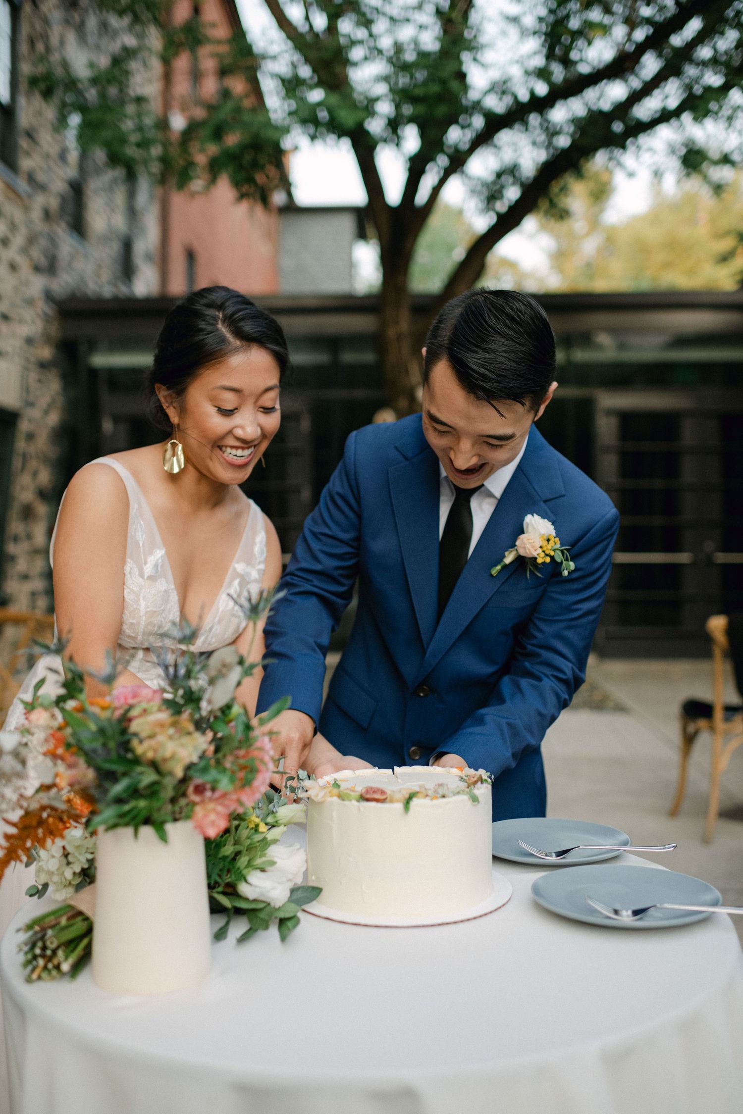 bride and groom cut the wedding cake