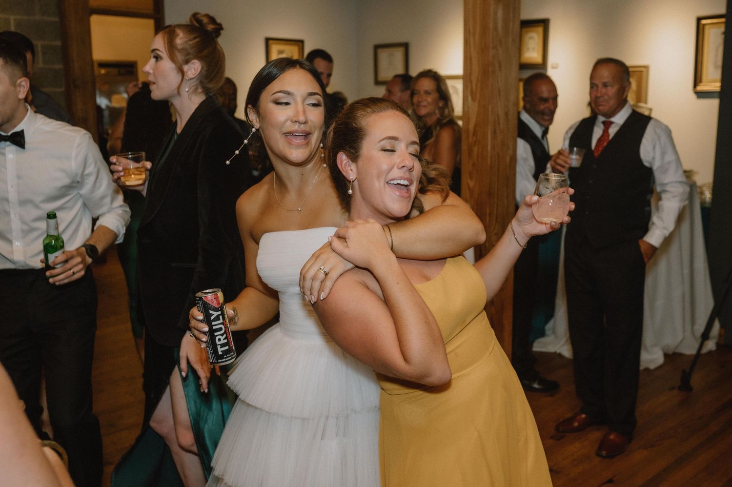 Wedding guests dance and celebrate together during a lively reception party.