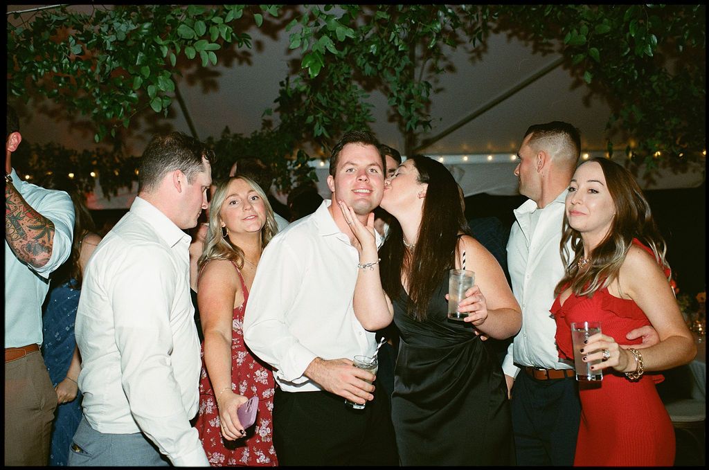 Lively dance floor scene with guests in formal attire enjoying an evening celebration at Strong Mansion on Sugarloaf Mountain