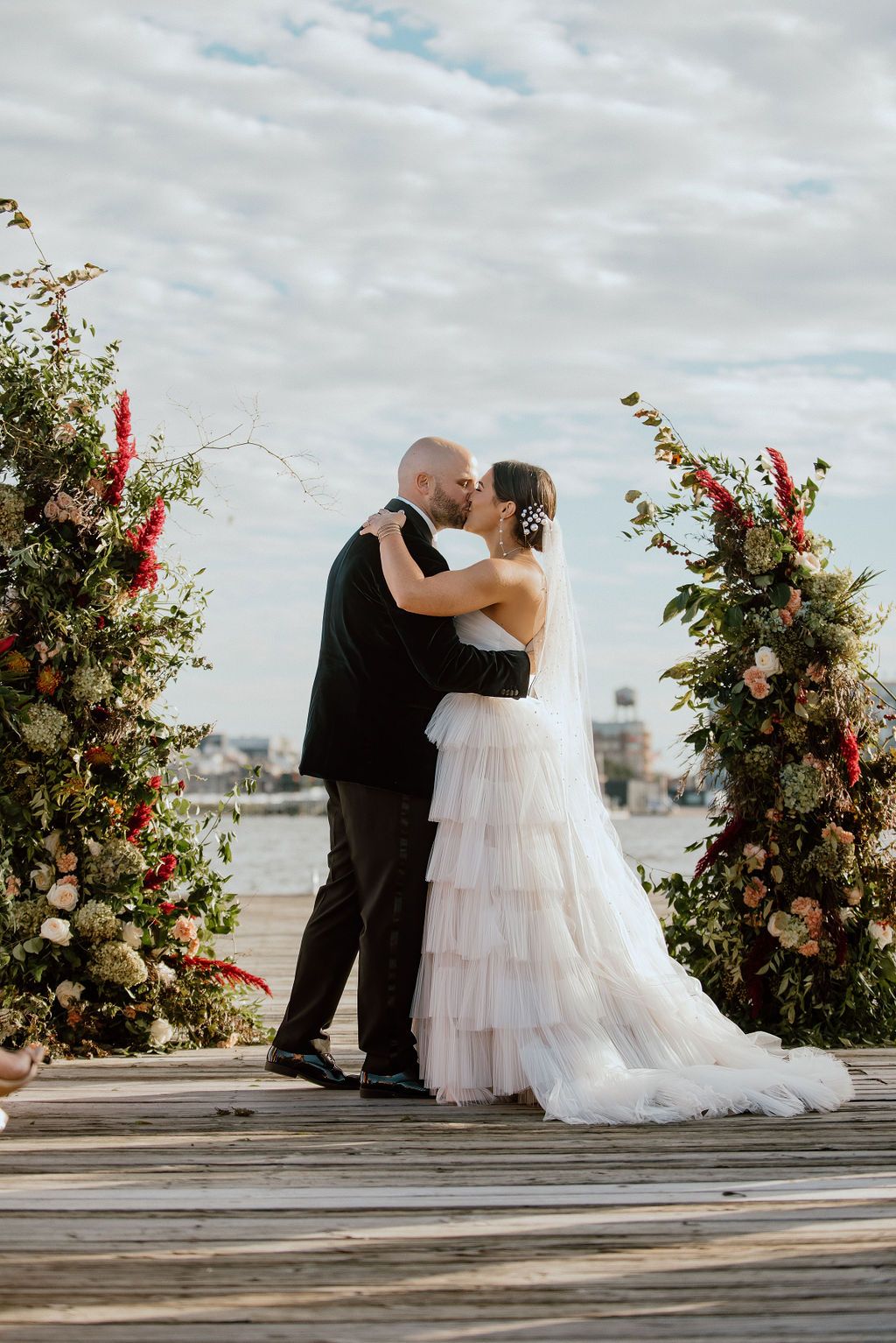 wedding ceremony on pier in the inner harbor at the frederick douglas maritime museum