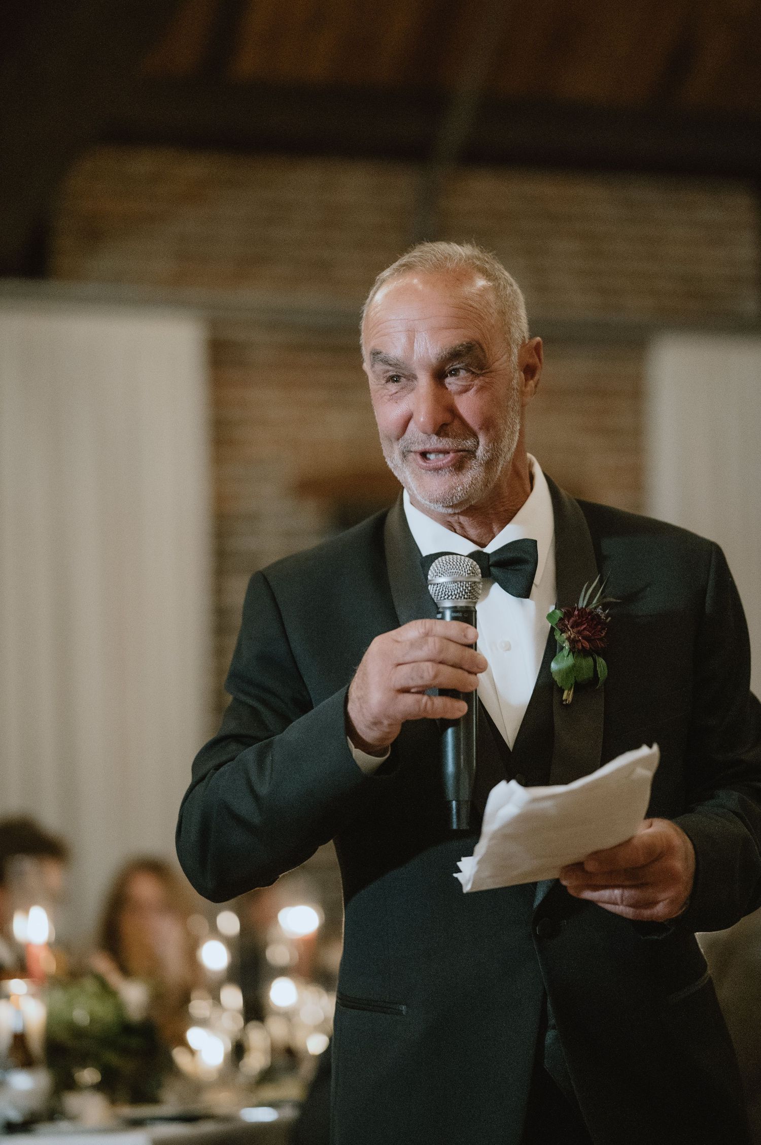 A formal reception speech moment captured during an elegant wedding celebration.