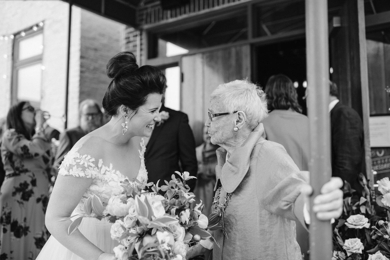 A touching black and white moment shared during wedding celebrations.