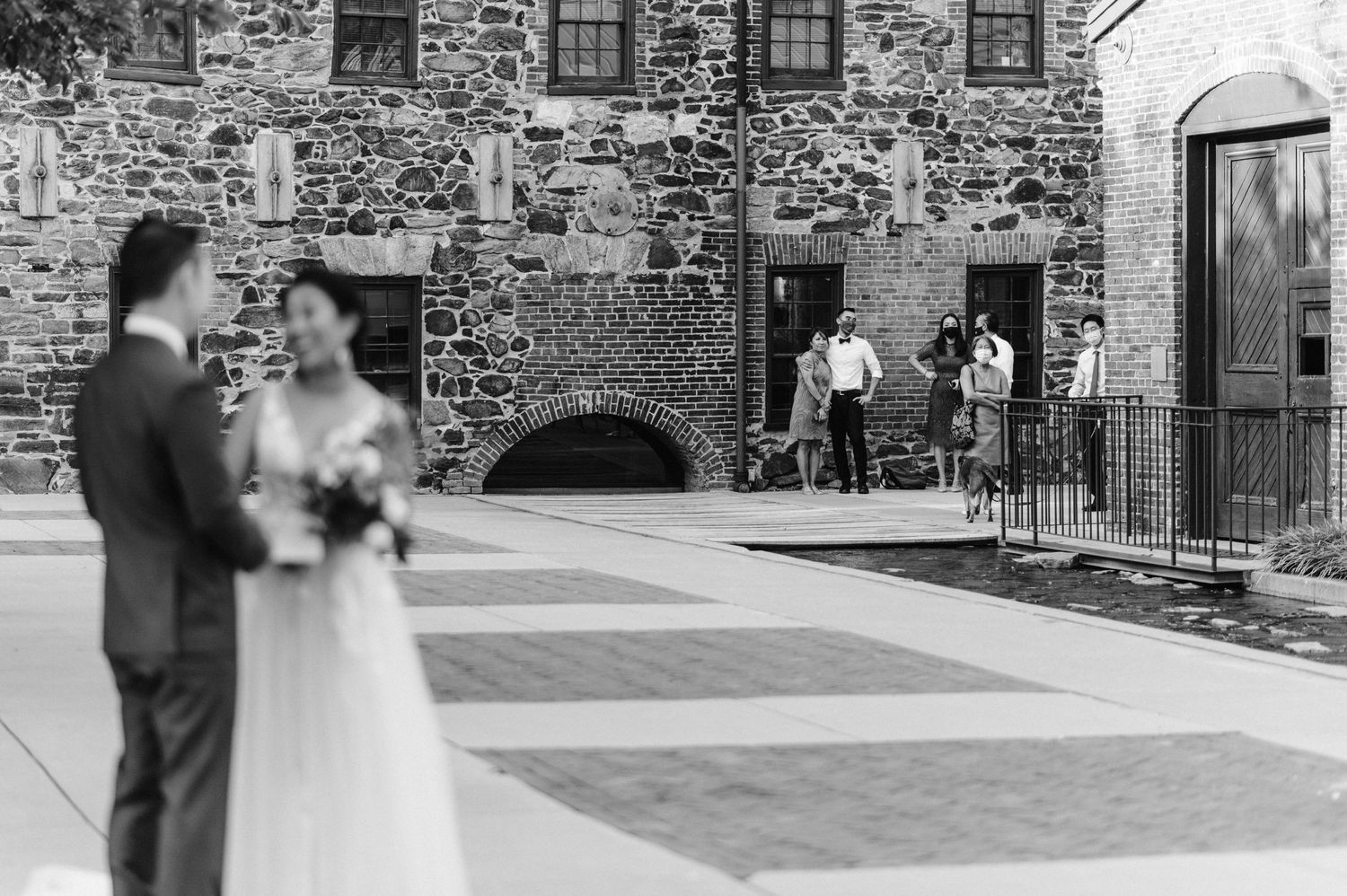 family watches couple share their vows from afar