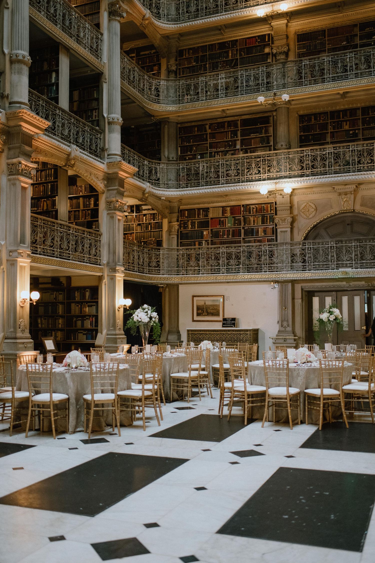 large room photo of the peabody library wedding reception tables