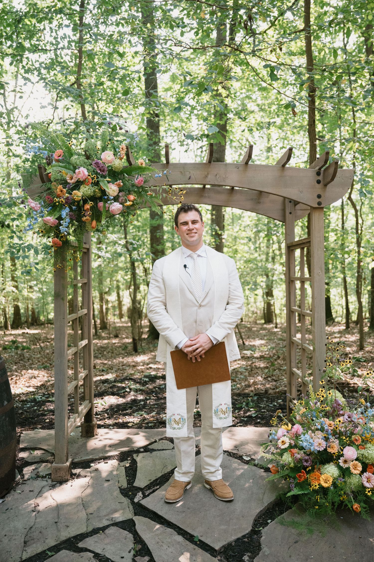 officiant waits for couple to walk down the asile