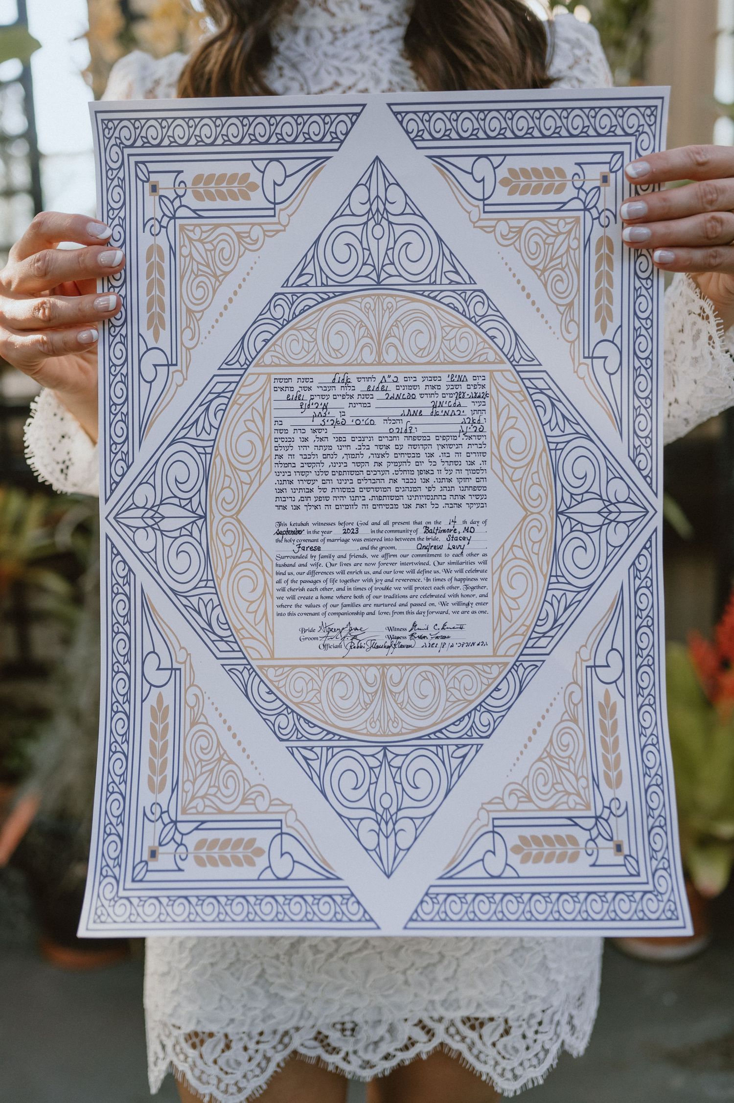 An ornate decorative marriage certificate with blue and gold geometric patterns and calligraphy.