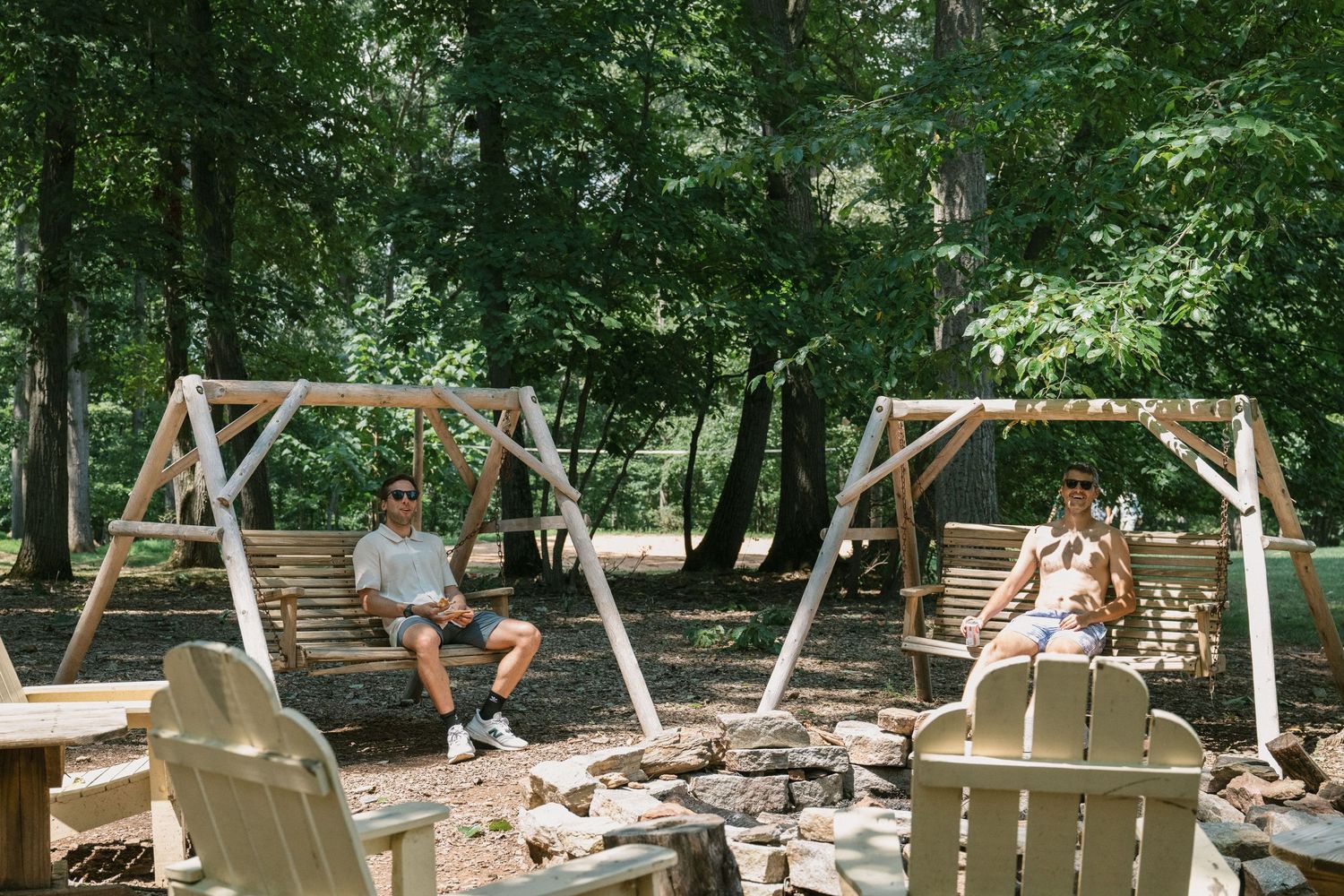 guests swing on wooden swings