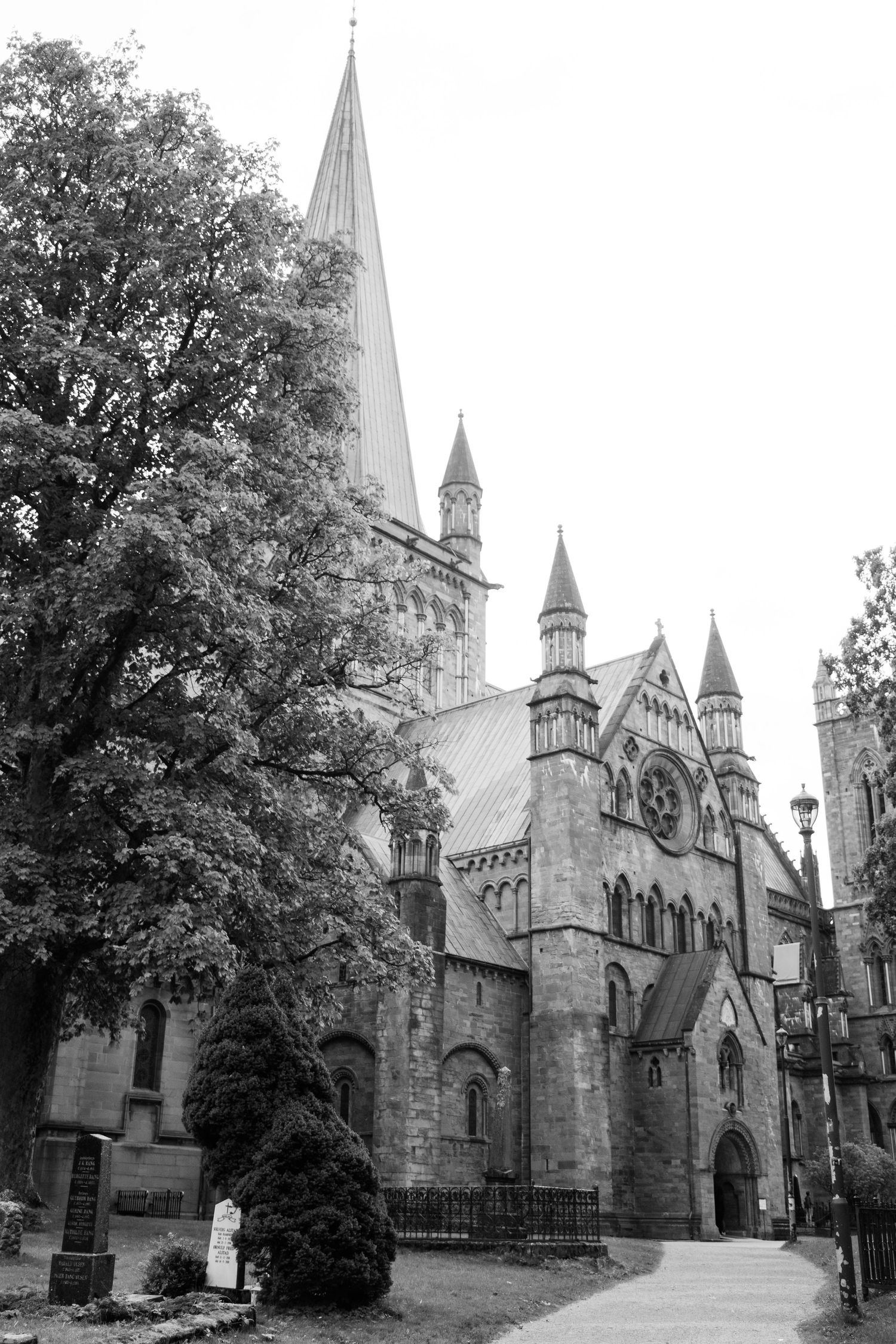Gothic cathedral with tall spires and stone architecture captured in black and white.