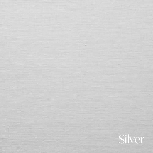 A minimalist silver text overlay on a light gray background creates a simple, elegant design element.