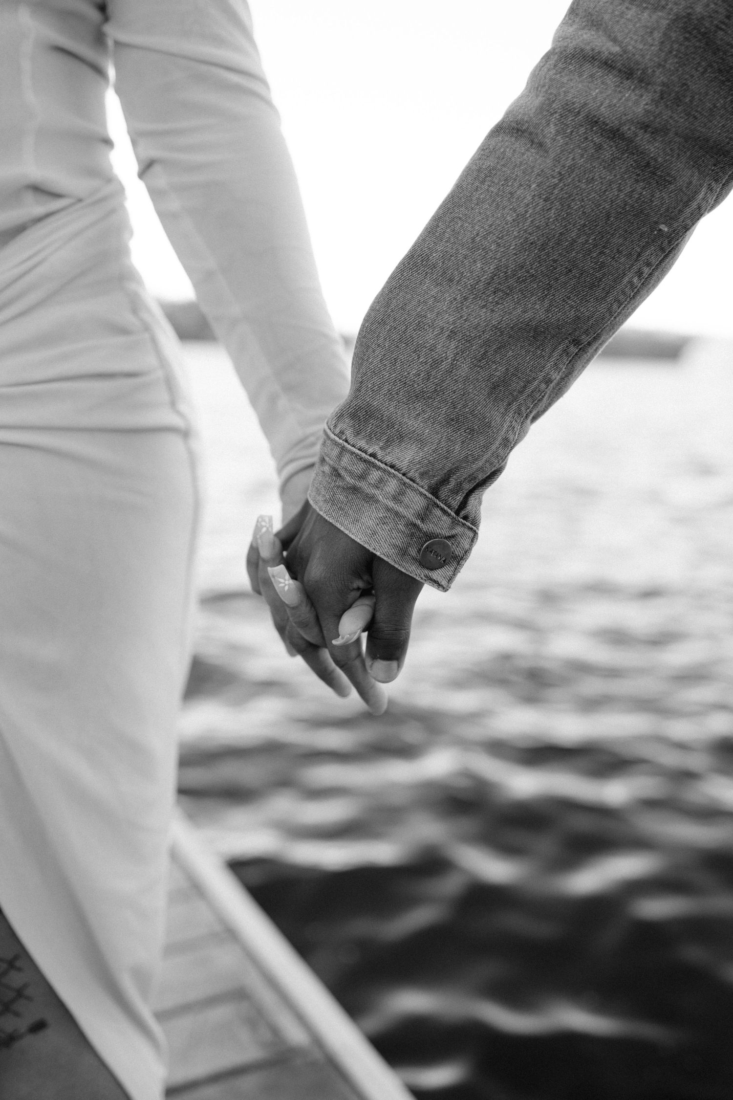 close up of holding hands during maternity photoshoot