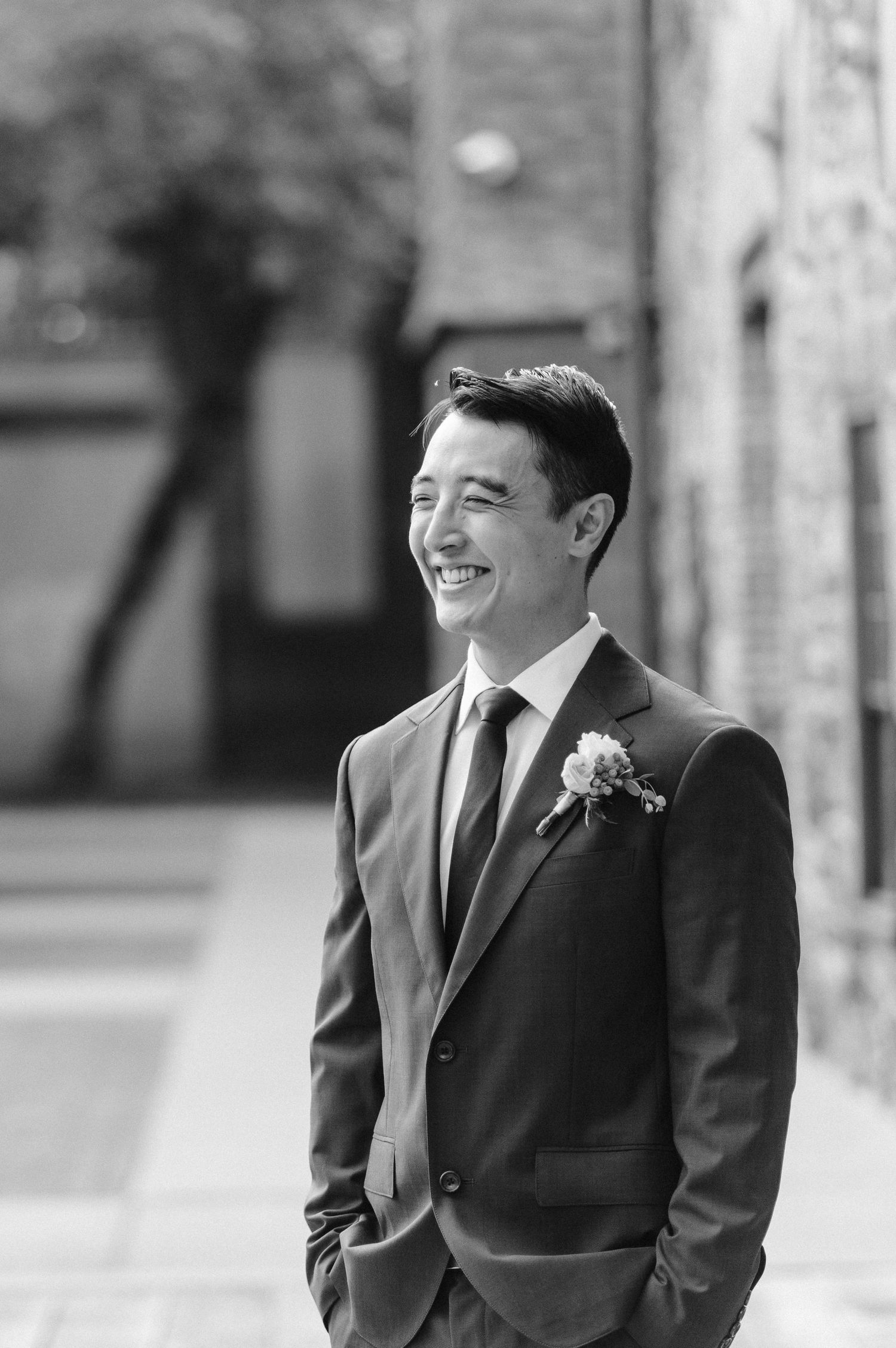 the groom smiles before the elopement ceremony