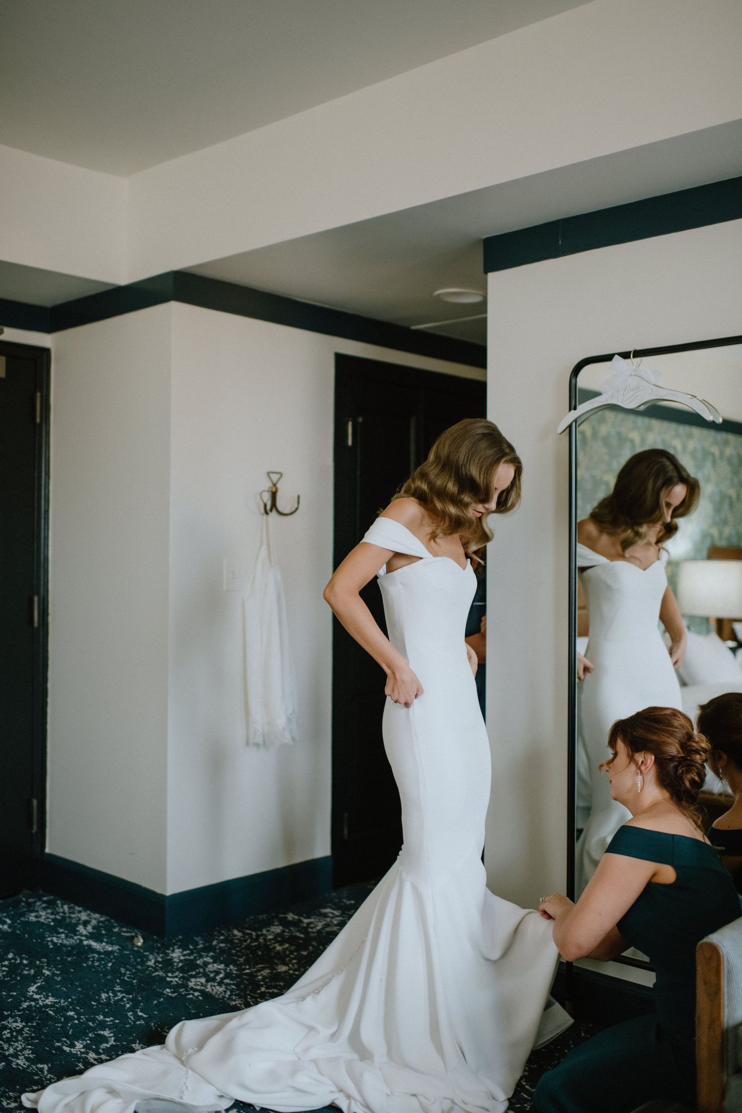 bride in form fitting wedding dress getting ready at Revival Hotel in Baltimore