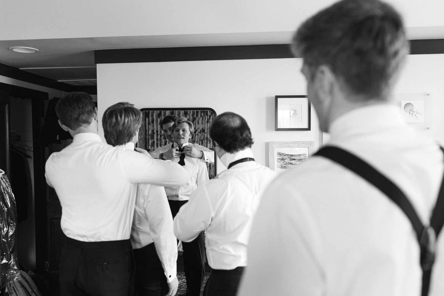 Black and white candid moments during wedding preparations.