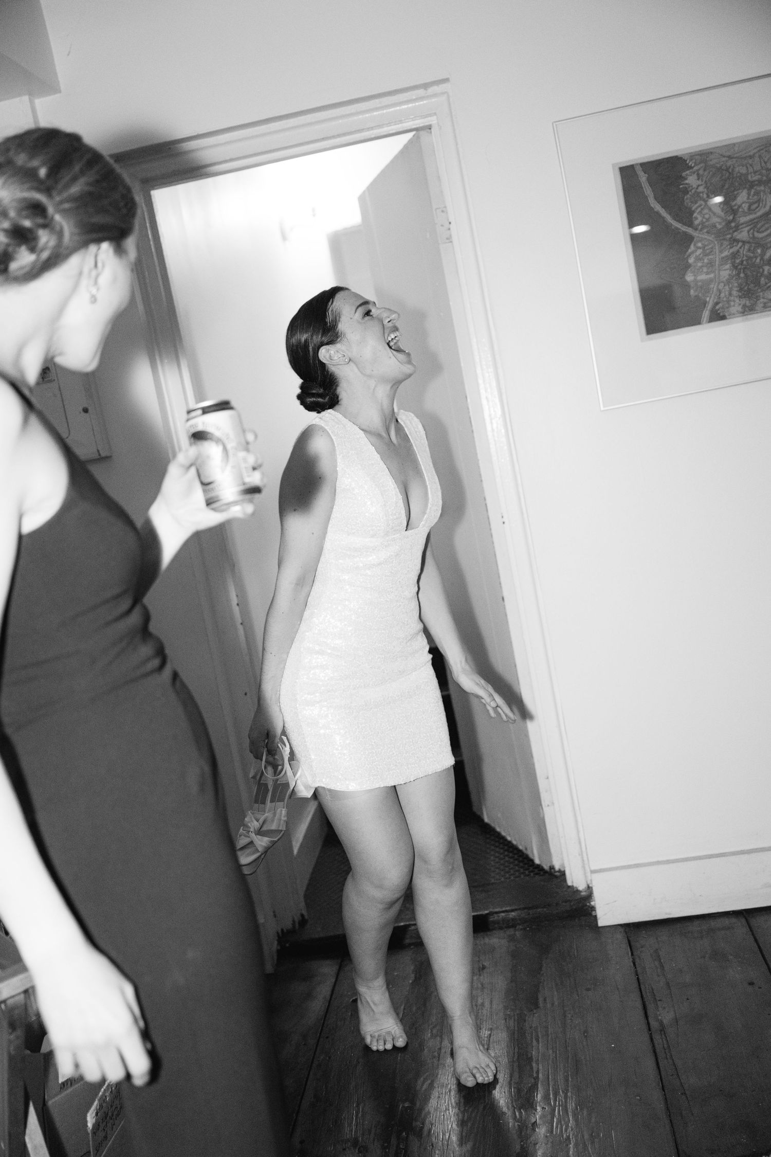 Black and white artistic photo series showing abstract motion and movement against white walls in an indoor space.