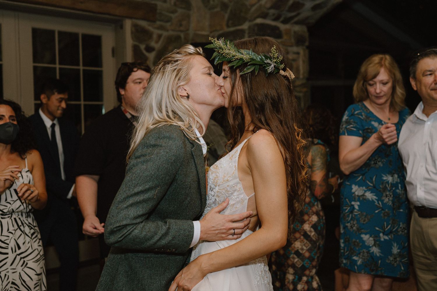 Intimate moment shared between couple during wedding reception festivities.