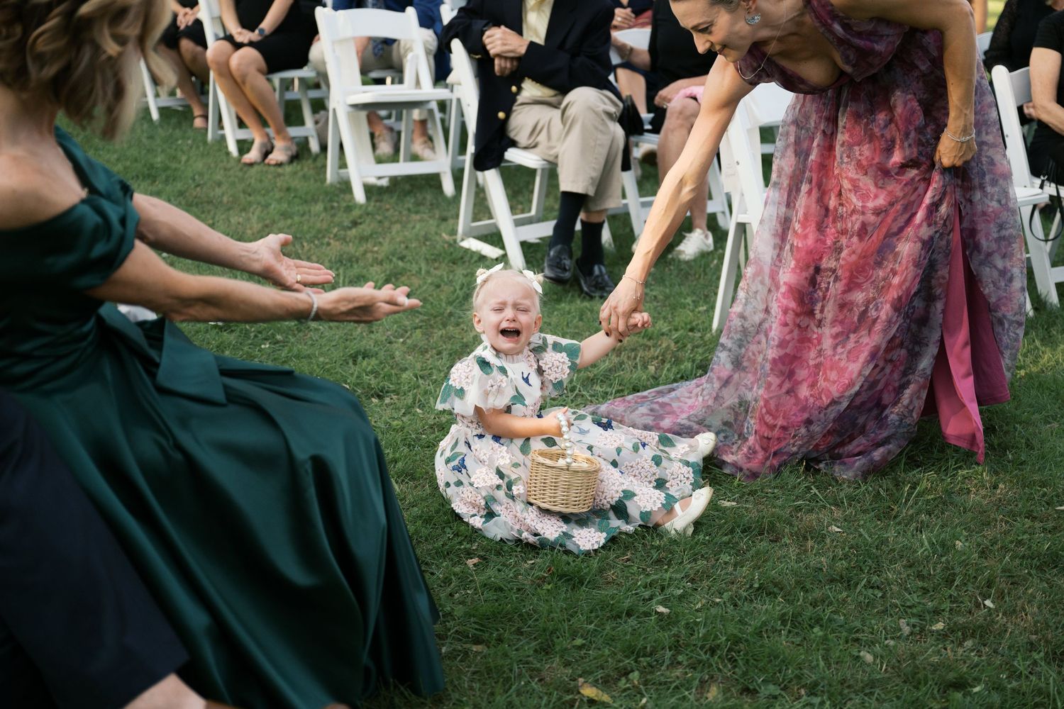 Wedding guests gathered on a lawn for an outdoor celebration.