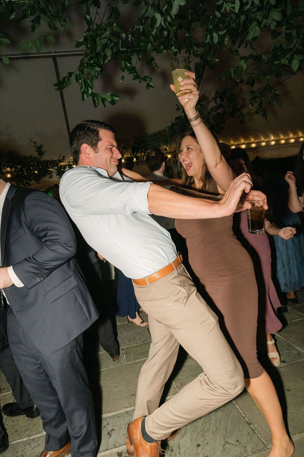Energetic dance moves captured at a wedding reception as guests enjoy the festivities at Strong Mansion on Sugarloaf Mountain
