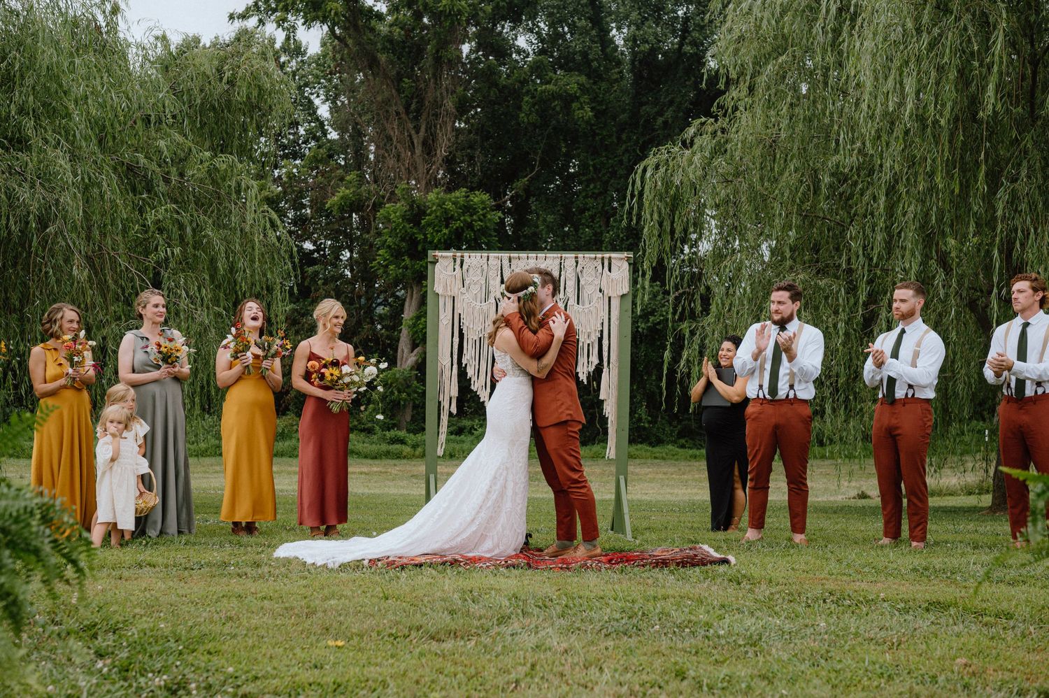 wedding kiss at alter just married boho bride and groom in maryland