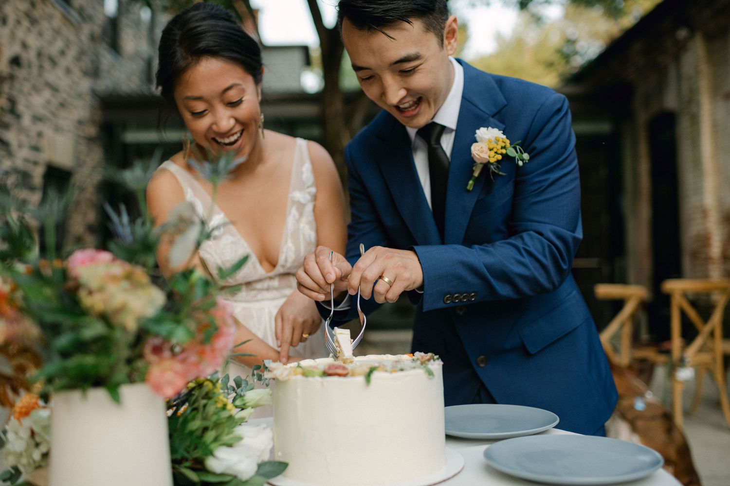 bride and groom cut the wedding cake