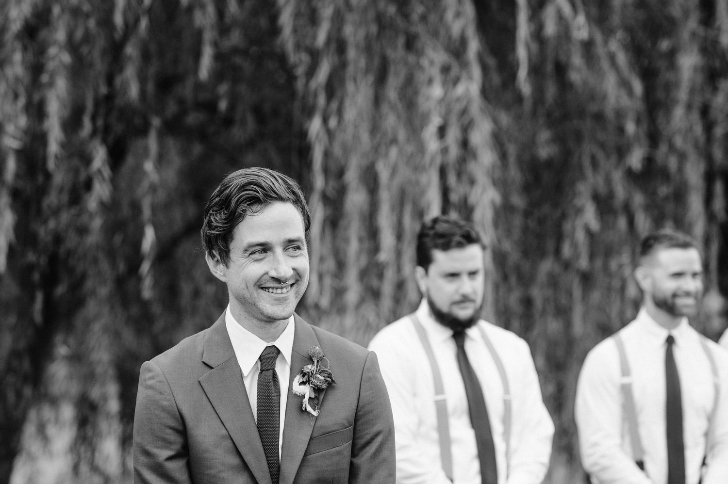 groom laughing candid wedding photojournalism backyard carefree wedding