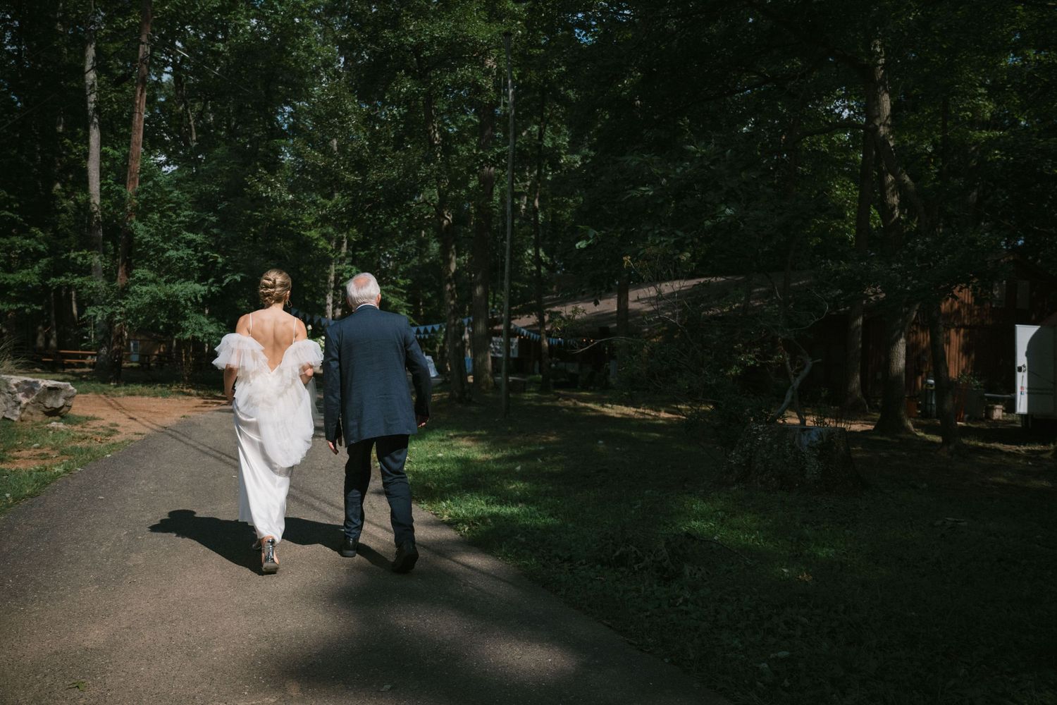 bride and father walk to ceremony
