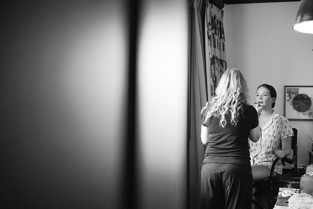 Moody black and white interior shot with dramatic lighting and shadows.