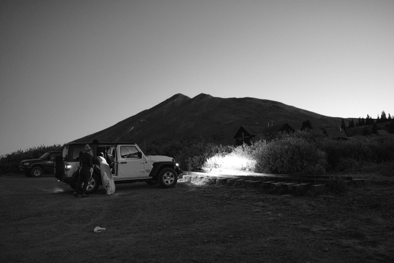 jeep in the dark with headlights on