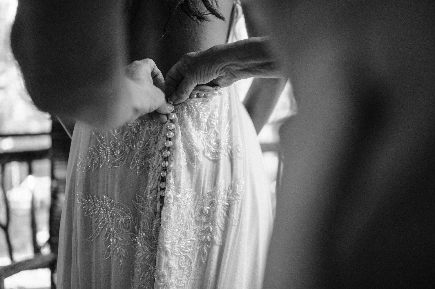 black and white wedding dress buttons close up