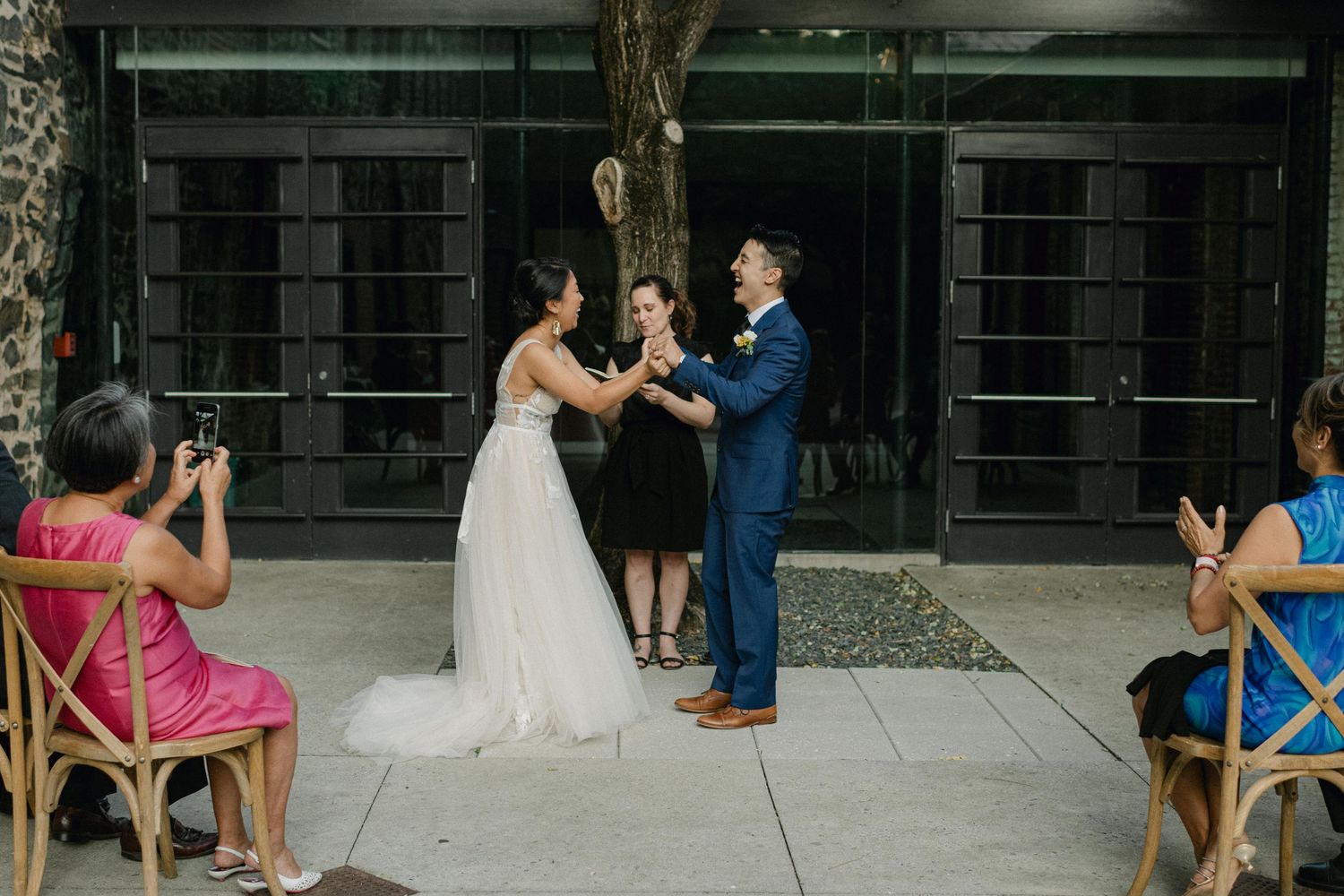 bride and groom laugh at wedding ceremony