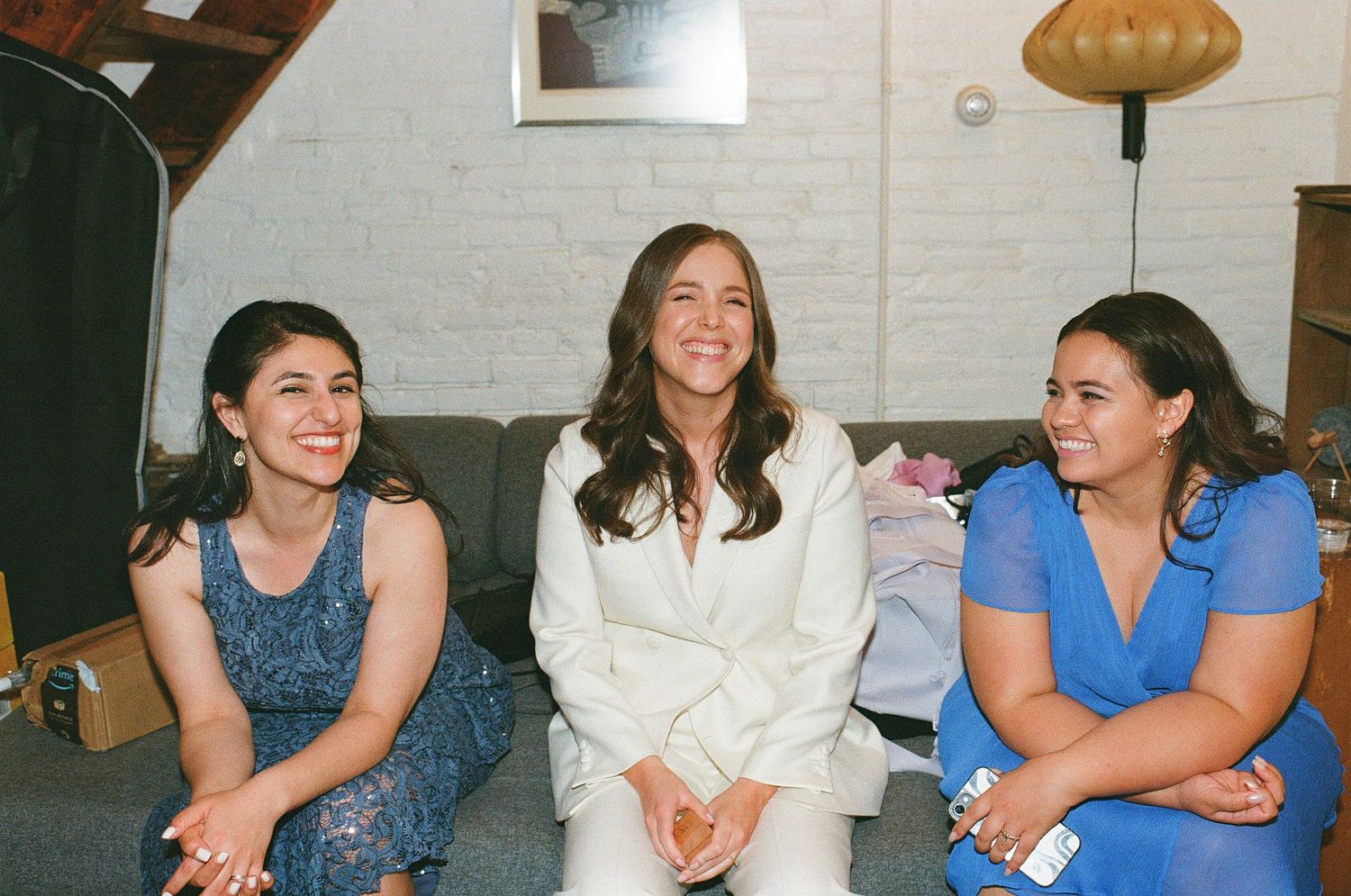 A group gathering showing people laughing and enjoying themselves in casual attire.