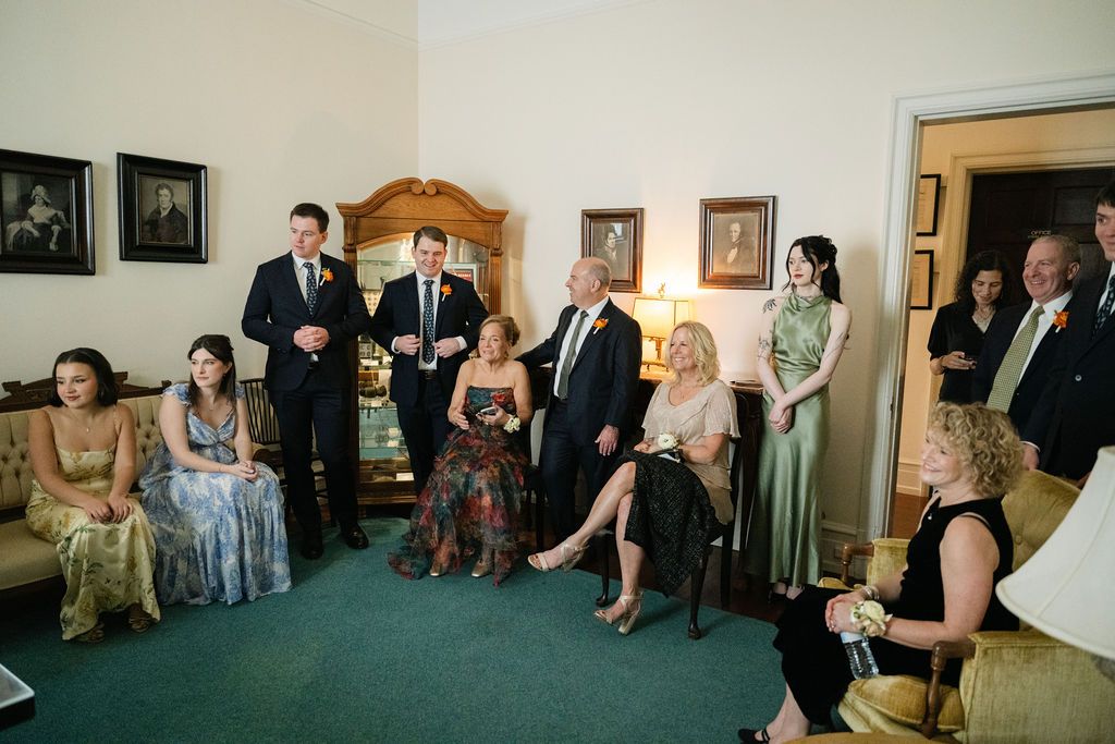 Wedding guests seated indoors during a ceremony or reception at Strong Mansion on Sugarloaf Mountain