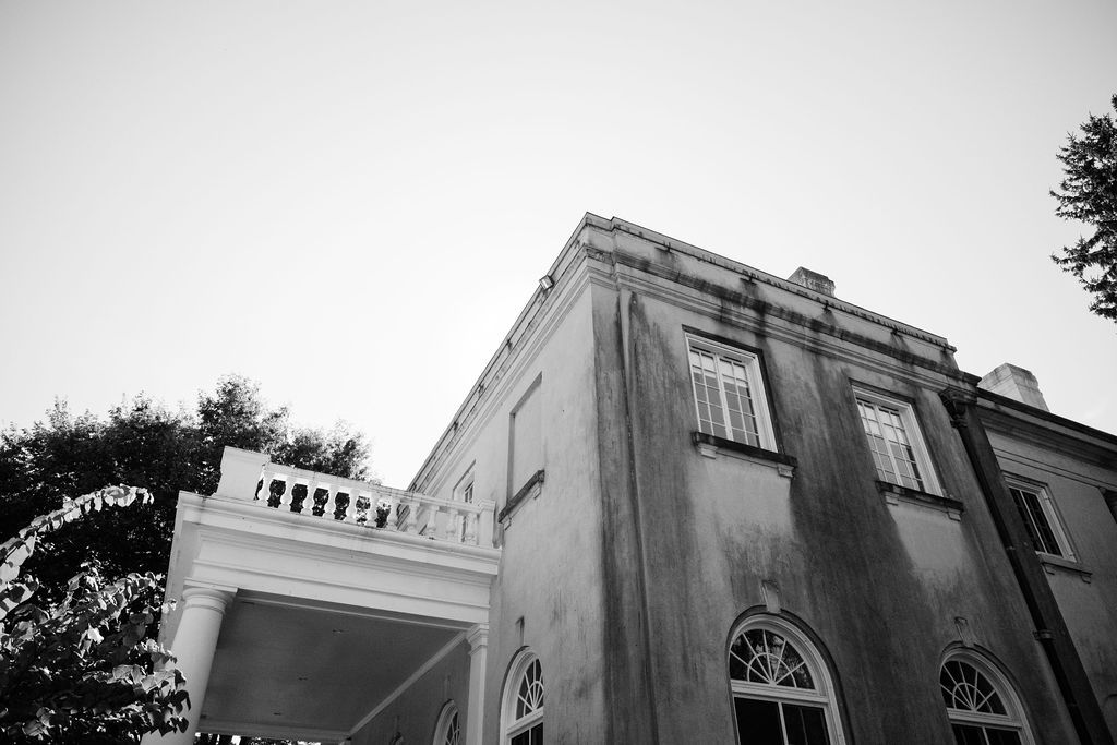 Black and white architectural detail of a historic building with arched windows and ornate trim at Strong Mansion on Sugarloaf Mountain