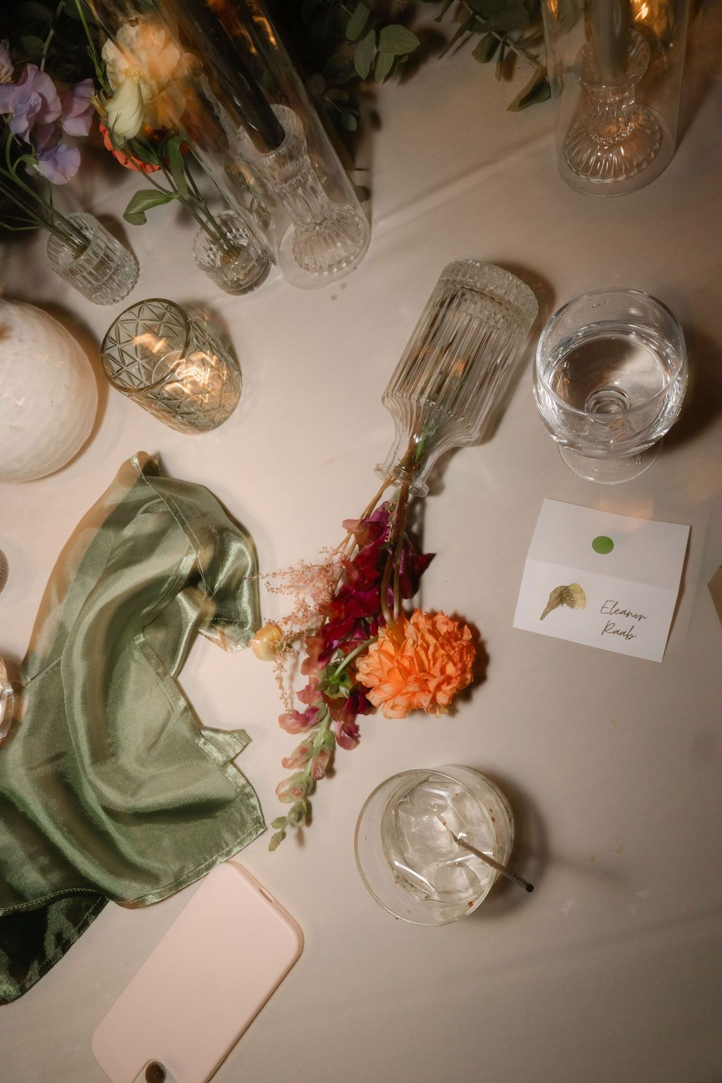 Wedding reception table details with crystal glasses, flowers, and decorative elements at Strong Mansion on Sugarloaf Mountain