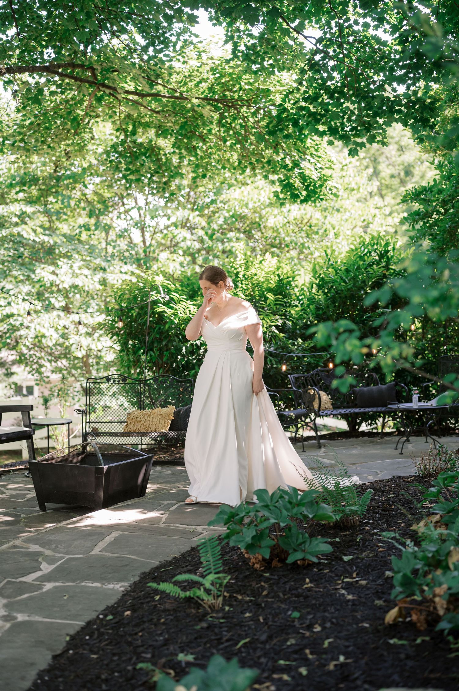 bride walks down path