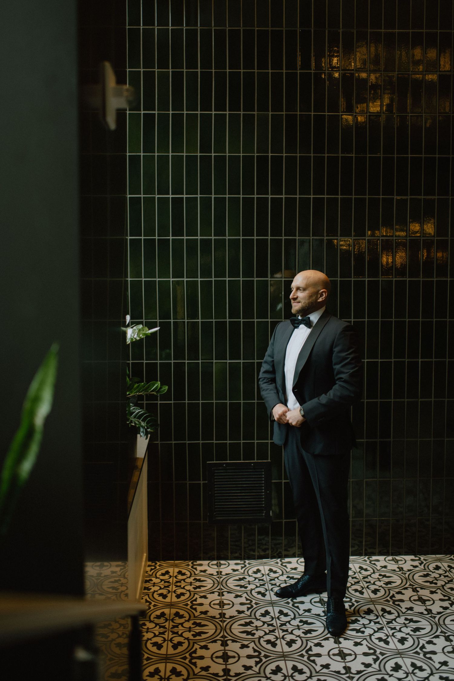 groom gets ready in lobby of revival hotel in baltimore