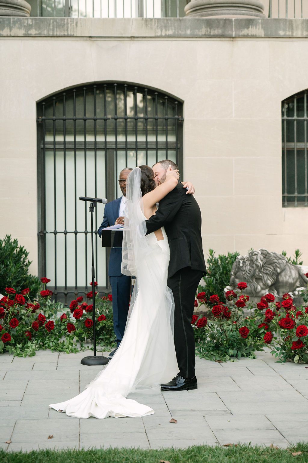 A series of wedding photos showing a couple posing against a stone wall with red roses in an elegant outdoor setting.