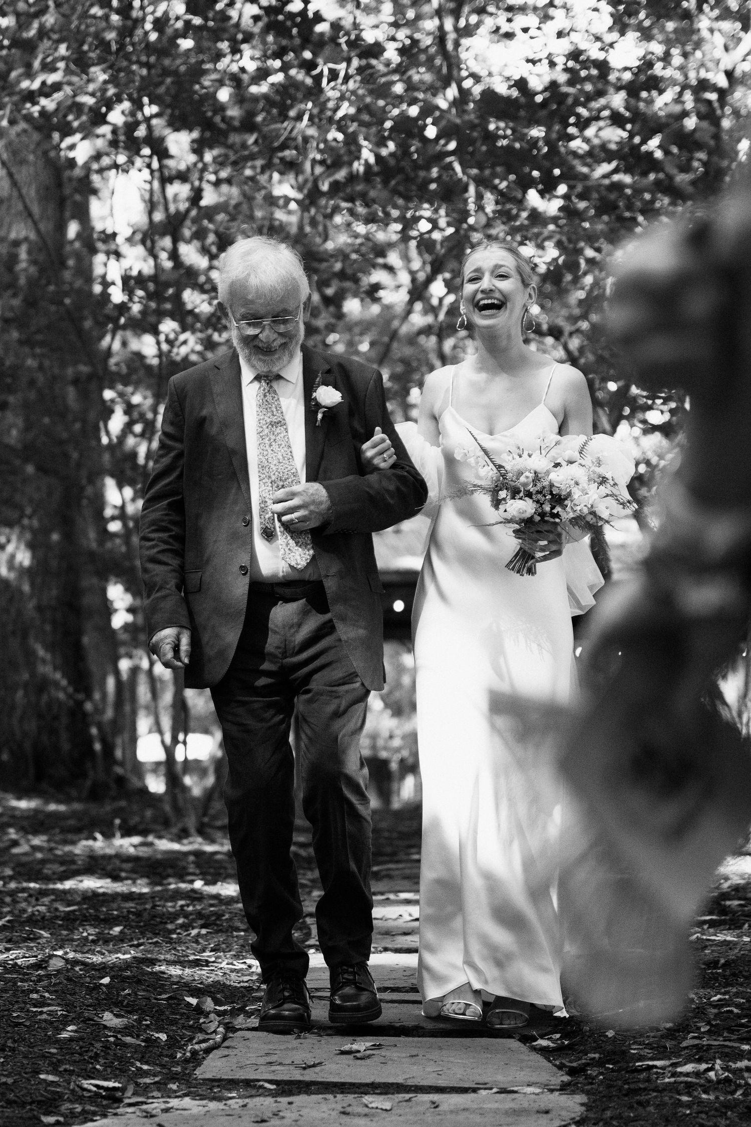 bride laughs when she see her groom