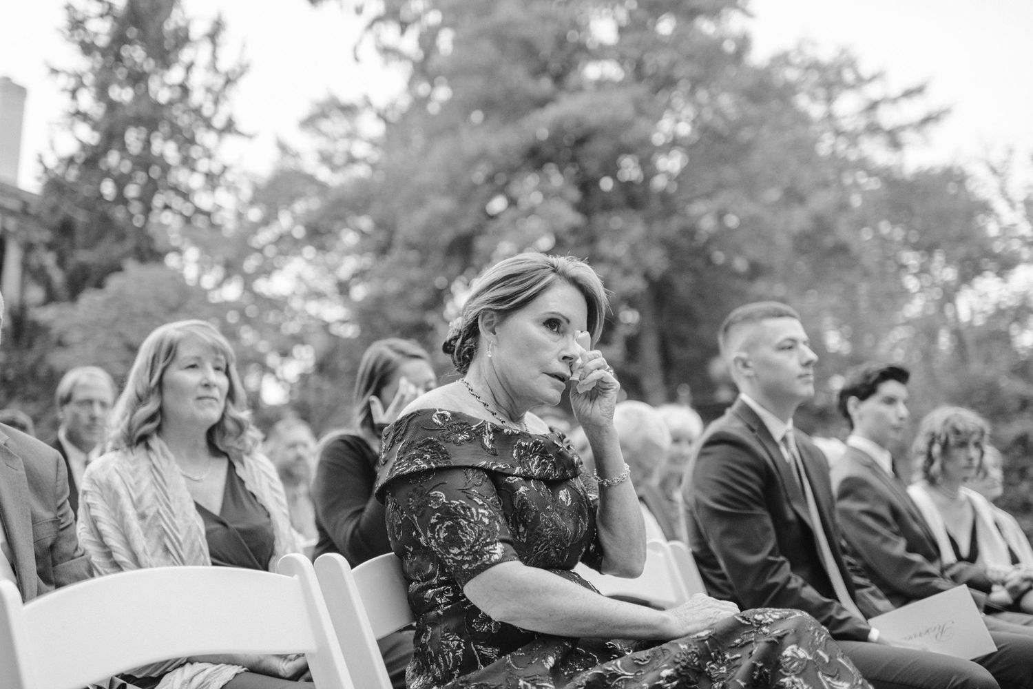 mother of bride crying at outdoor wedding ceremony