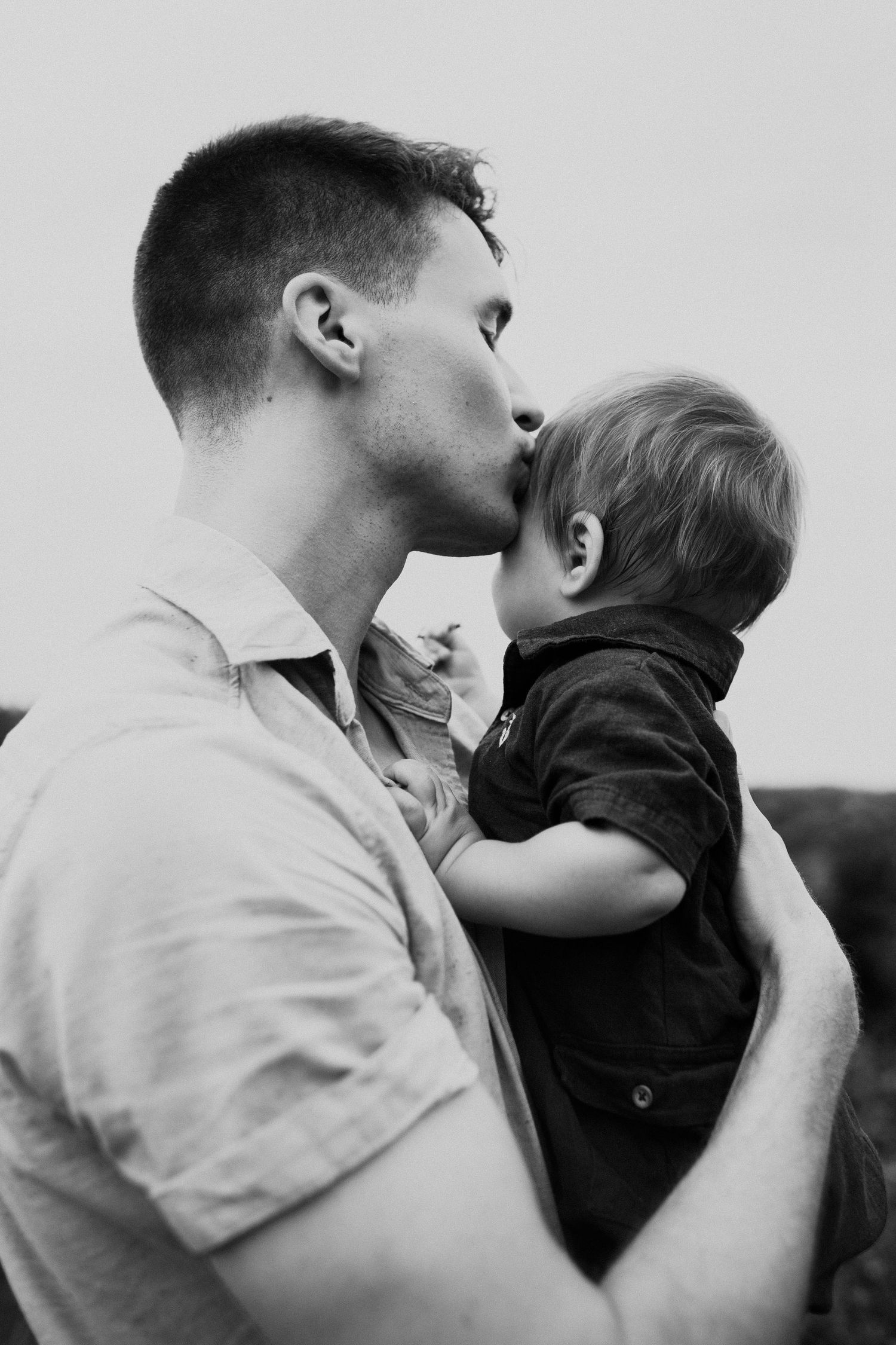 Black and white intimate portrait of tender parental moment.