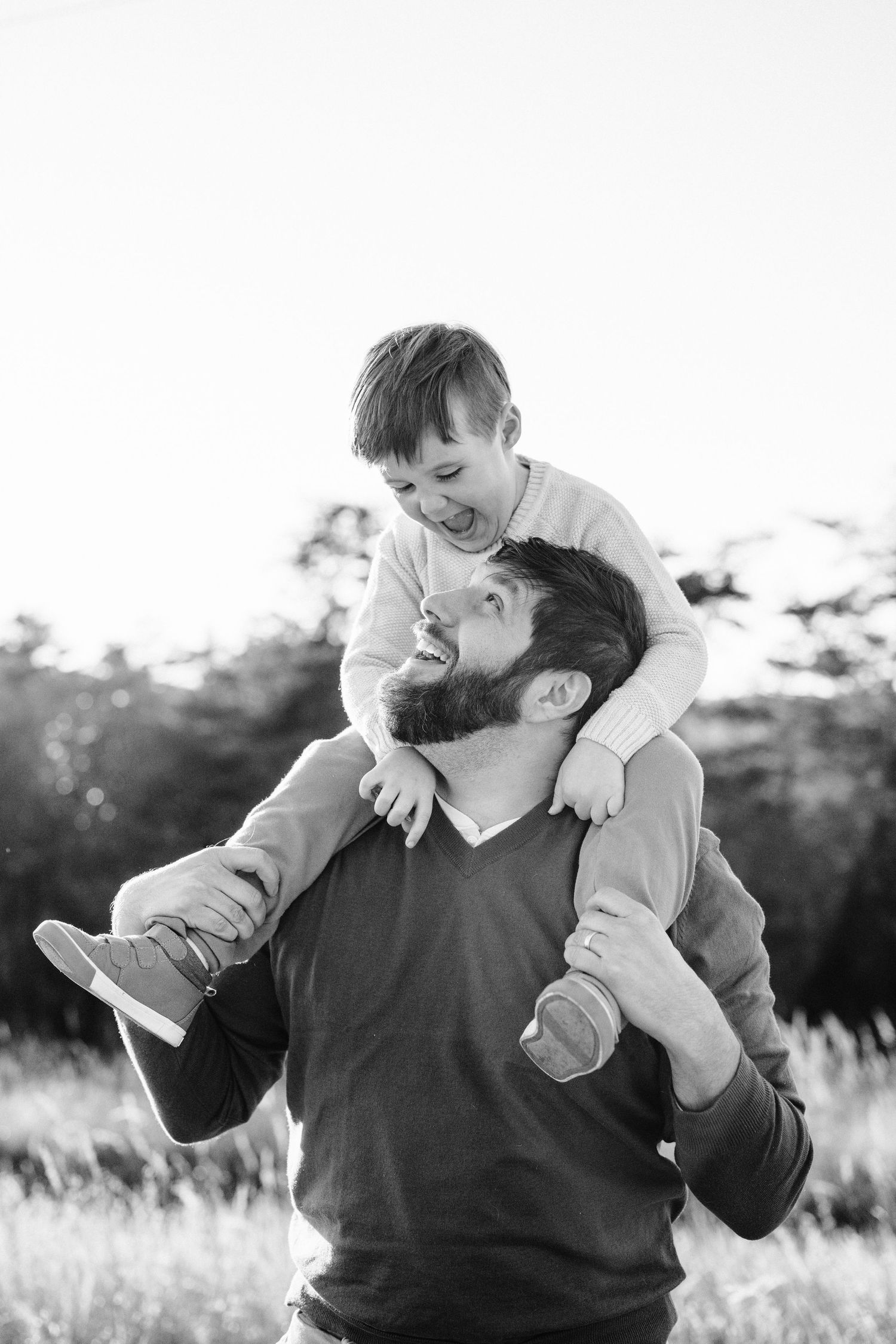 A joyful black and white moment captured outdoors during playtime.