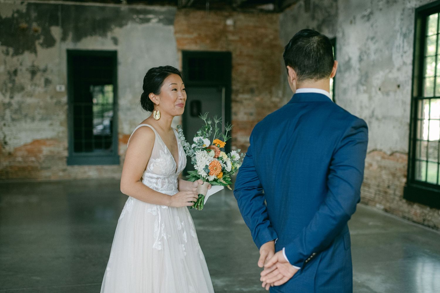 bride surprises groom at first look