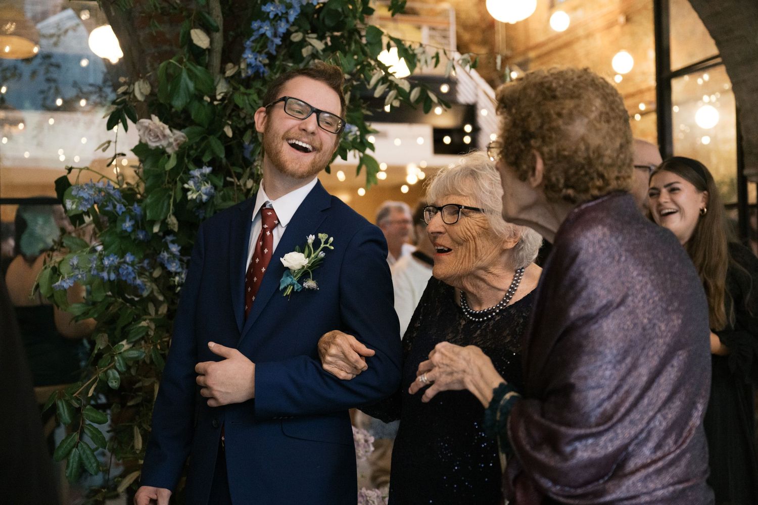 A heartwarming moment of laughter shared during a wedding reception.