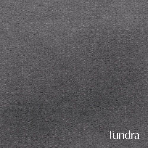A solid gray fabric swatch labeled Tundra with a textured linen appearance.