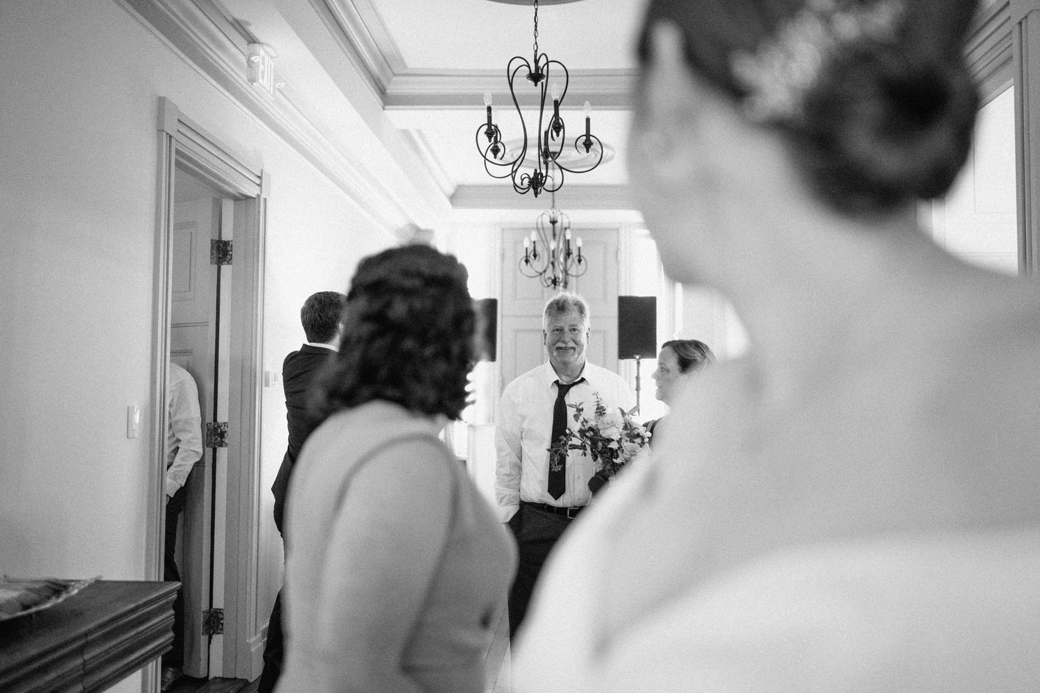 brides dad smiles at her
