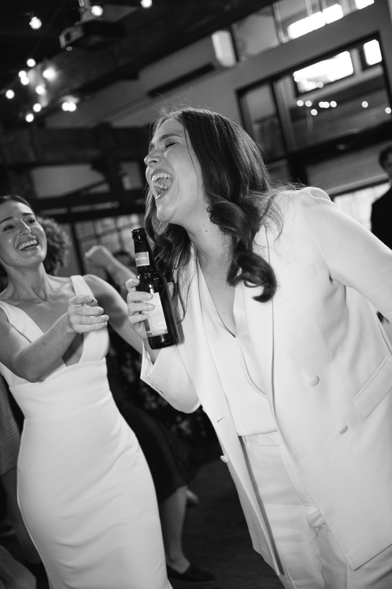 Multiple black and white candid photos show people laughing and enjoying drinks in a casual social setting.