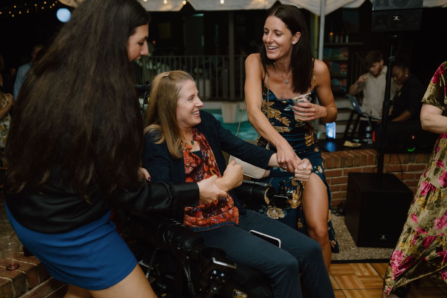 Guests socializing and having fun at an evening celebration.