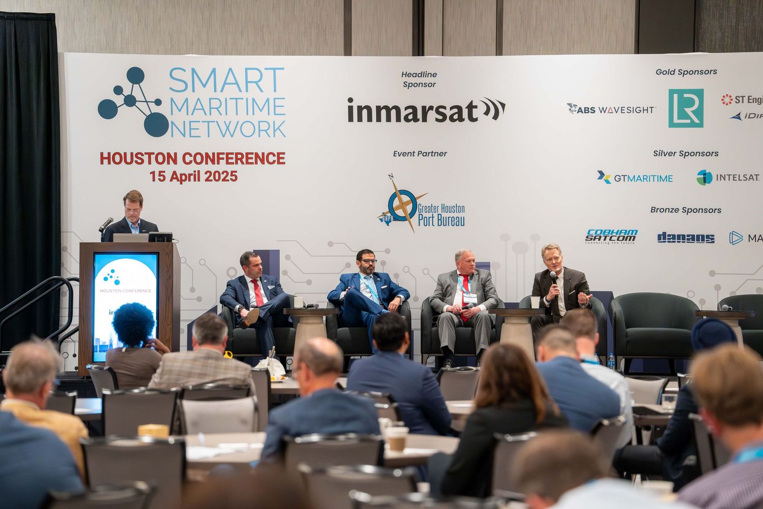Event photography showcasing a panel at a corporate conference in Houston.