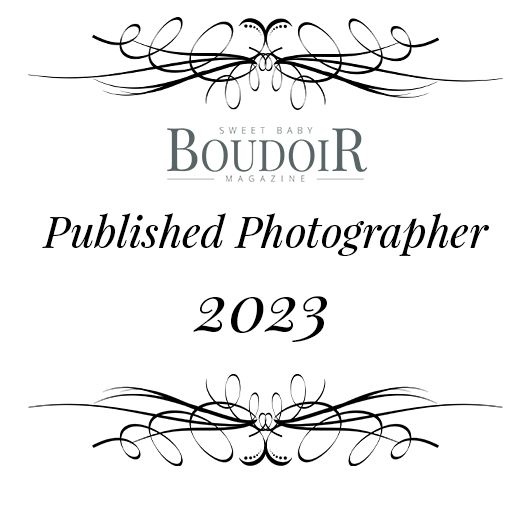 Elegant grayscale Boudoir logo with flowing calligraphic design elements and Published Photographer 2023 text.