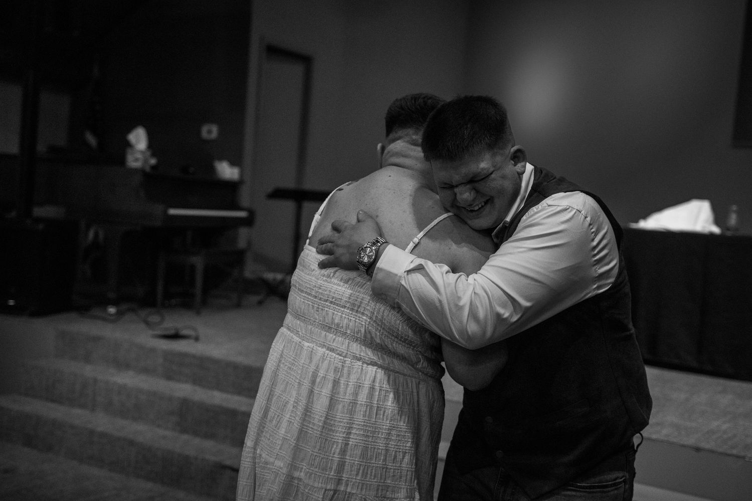 Black and white wedding photo sequence showing intimate moments between newlyweds during their celebration.